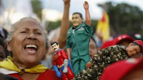 Getty Supporters of President of Venezuela Nicolas Maduro attend a rally ahead of the presidential election on July 18, 2024 in Caracas, Venezuela. 