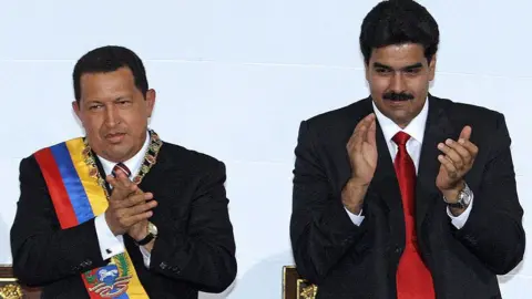 Getty Photo dated 05 July 2006 of Venezuelan President Hugo Chavez (L) and Foreign Minister Nicolas Maduro attending a session of he Venezuelan Congress in Caracas.