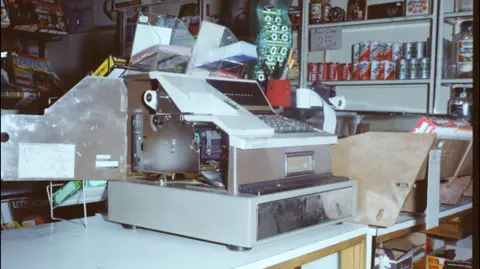 Bedfordshire Police A broken shop till at the shop of the scene of Carol Morgan's killing