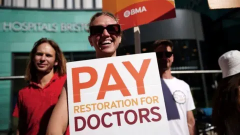 PA Media Striking junior doctors outside a hospital in Bristol