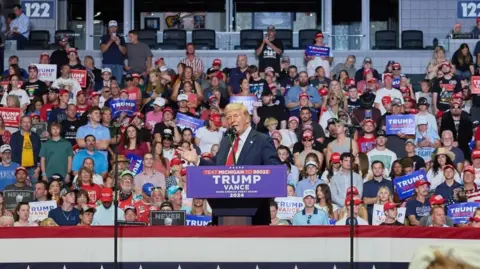 EPA Donald Trump addresses a rally in Michigan