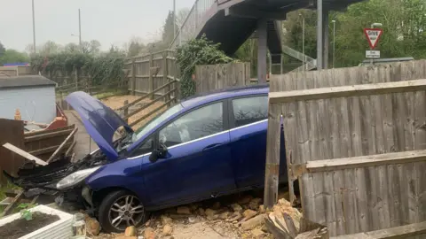 Fiona Caller a photo of a car that had crashed into a fence