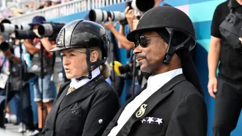 Reuters U.S. rapper Snoop Dogg watches the Dressage Team Grand Prix Special