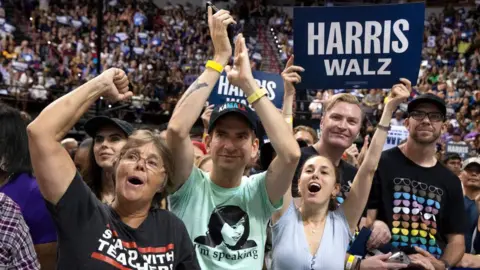 AFP Supporters of Democratic presidential candidate Kamala Harris cheer as she speaks during a campaign rally