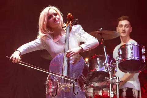 Getty Images Grace Chatto plays cello in concert with Clean Bandit