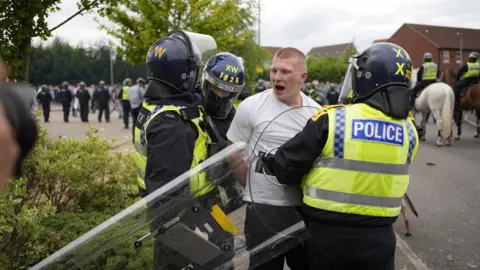 PA Media Liam Gray during an anti-immigration demonstration outside the Holiday Inn Express in Rotherham