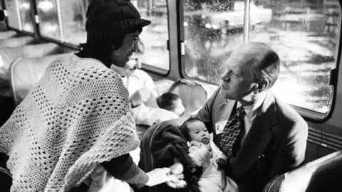 Getty Images President Gerald Ford held Viet children as they arrived in the United States