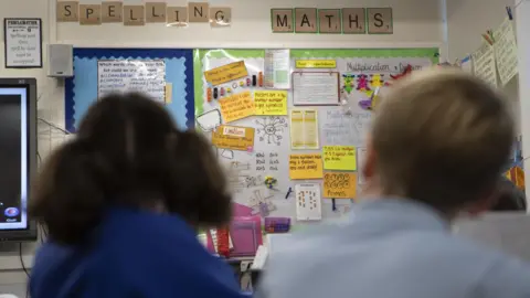 PA Media Two pupils sitting in a classroom