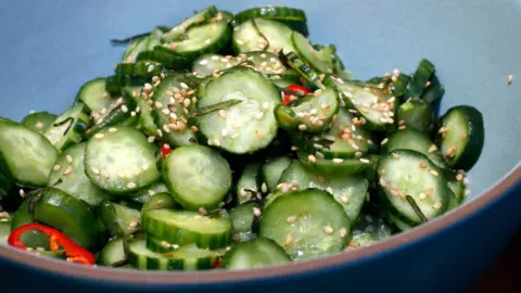 Getty Images Cucumber salad presented nicely on a plate