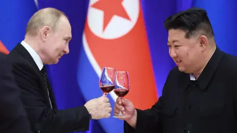 Getty Images ussian President Vladimir Putin and North Korean leader Kim Jong Un toast during a reception at the Mongnangwan Reception House in Pyongyang on June 19, 2024.