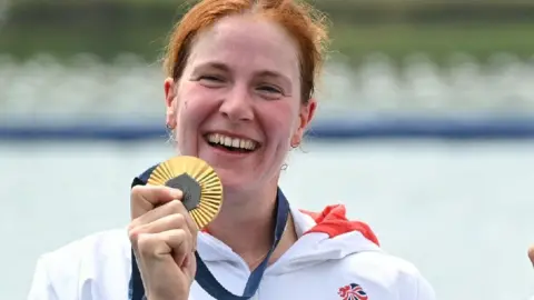 Getty Images Georgie Brayshaw holds a gold medal