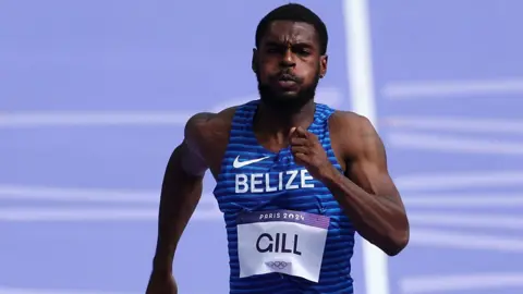 Getty Images Shaun Gill competes in the men's 100m race