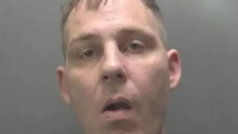 Cambridgeshire Police Clean-shaven man looking at camera