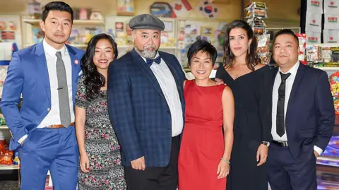 Getty Images Kim's Convenience TV series cast pose at the CBC World Premiere VIP Screening