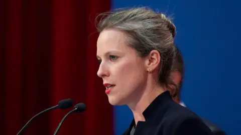 Guillaume SOUVANT/AFP Nouveau Front Populaire (New Popular Front) NPF left-wing coalition candidate for prime minister and economist, Lucie Castets delivers a speech during the French left-wing Parti Socialiste (PS) Campus at Blois, central France on 30 August 2024