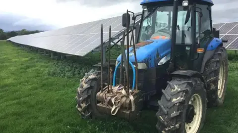 Tractor by solar panels