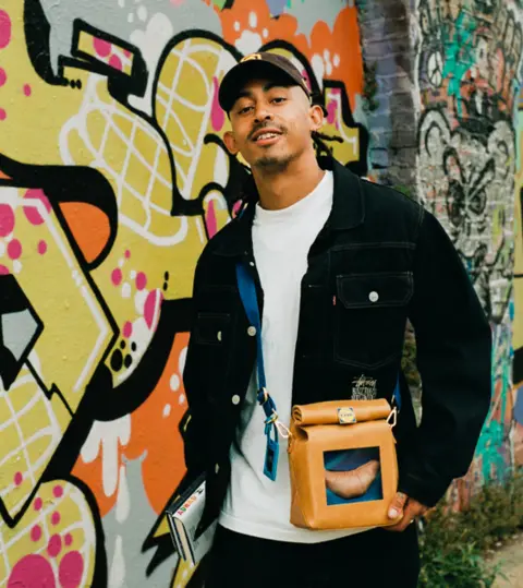 Nik Bentel Jordan Stephens from Rizzle Kicks wearing Lidl bag