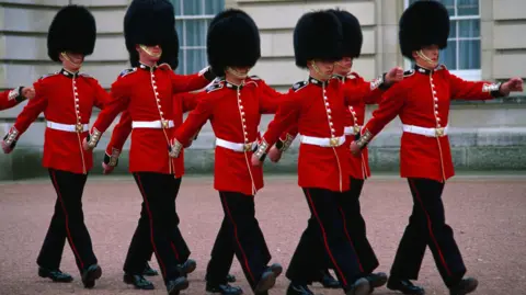 Getty Images Guards marching outside Buckingham Palace