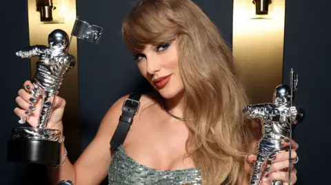 Getty Images Taylor Swift poses with her MTV Awards