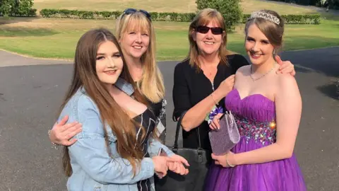 Evie Kelsall Evie with her mum and two sisters